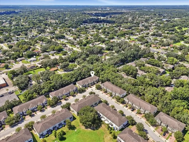 Aerial view showcasing the tree-lined community and prime lot location