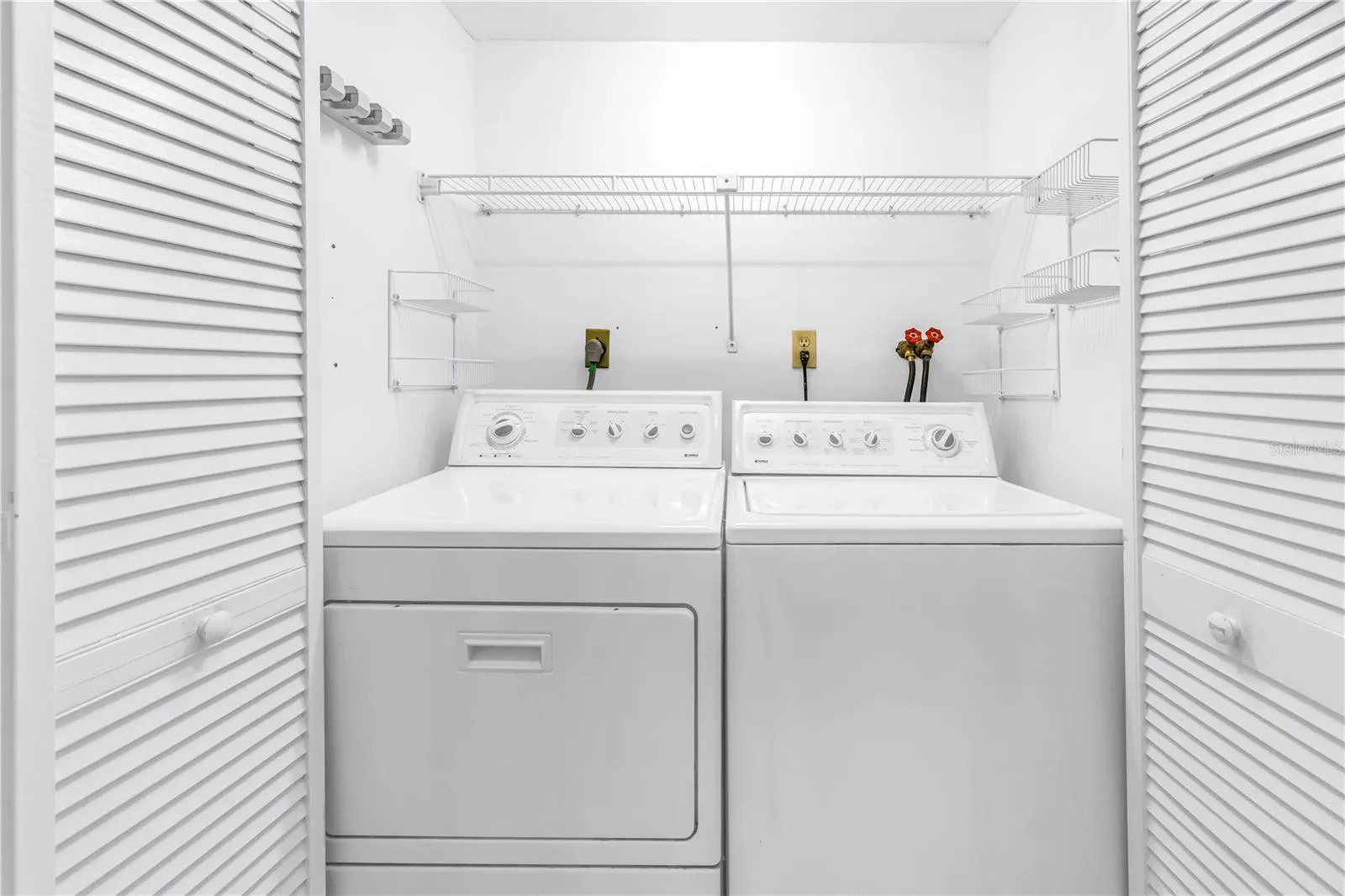 Inside Laundry Closet with full size Washer and Dryer
