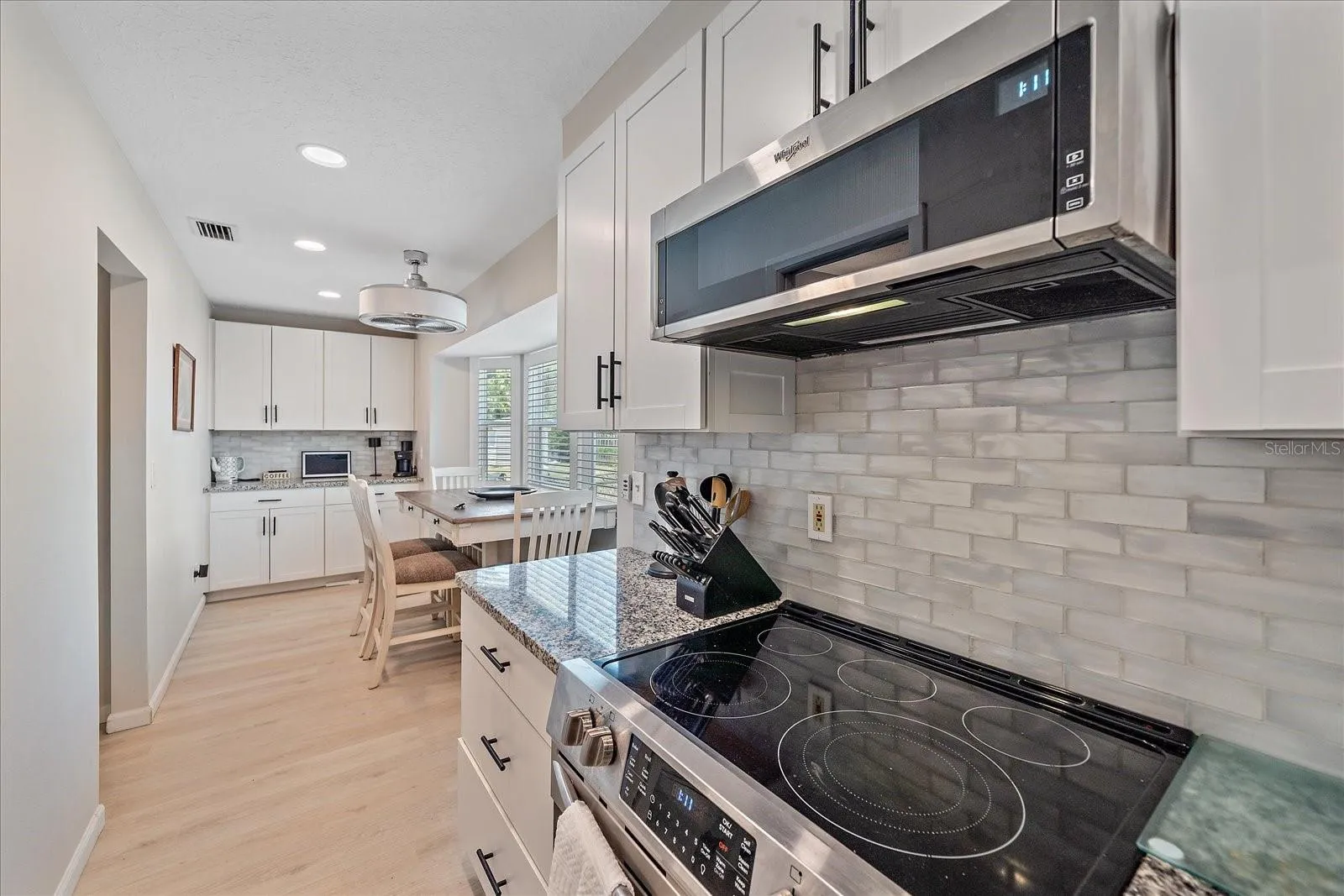 oven / eating area and end coffee counter and cabinets
