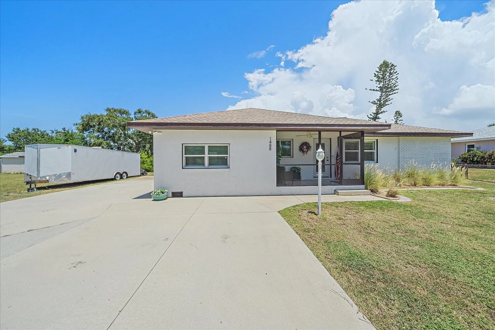 parking and rv / trailer park pad, front of house