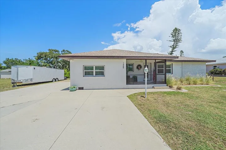 parking and rv / trailer park pad, front of house