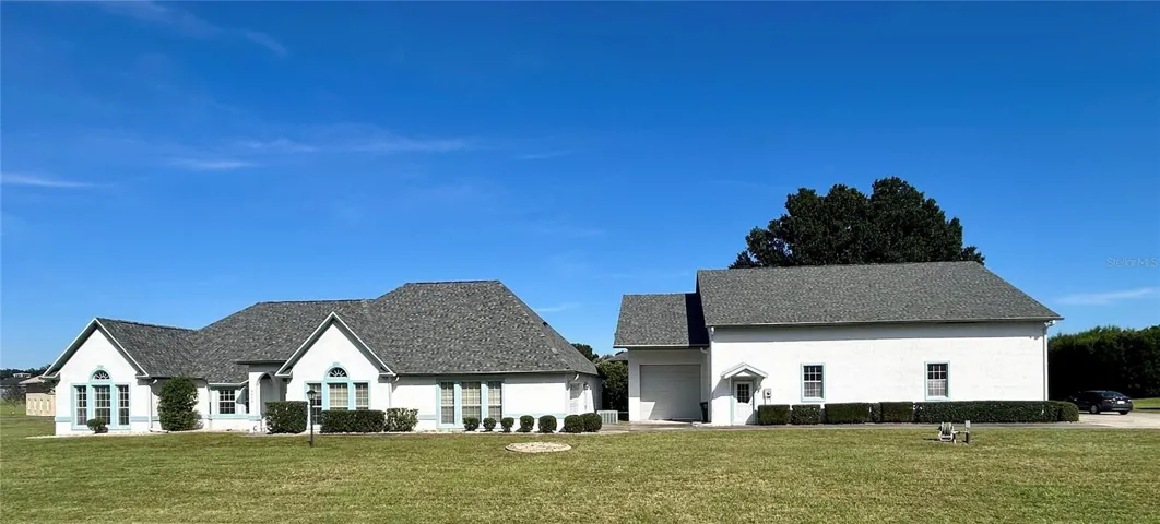 Front of house, detached workshop, then hangar