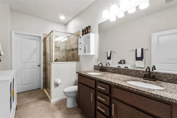 Primary Bath with Walk in Shower, Dual Vanities, and Walk in Closet