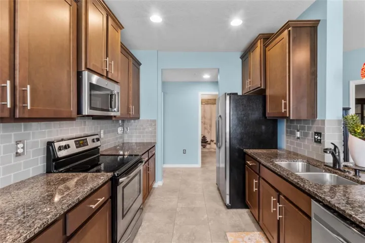Kitchen with Stainless Steel and Granite Countertops