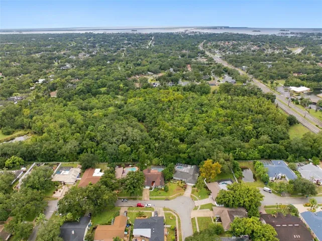 Nestled among the tree-lined streets of Spanish Pines, this residence backs onto Curlew Pond Nature Preserve.