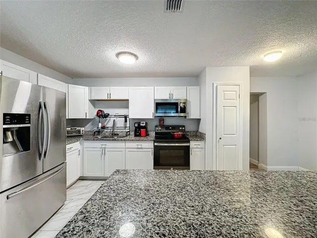 FRONT ANGLE KITCHEN FROM FRONT GRANITE ISLAND