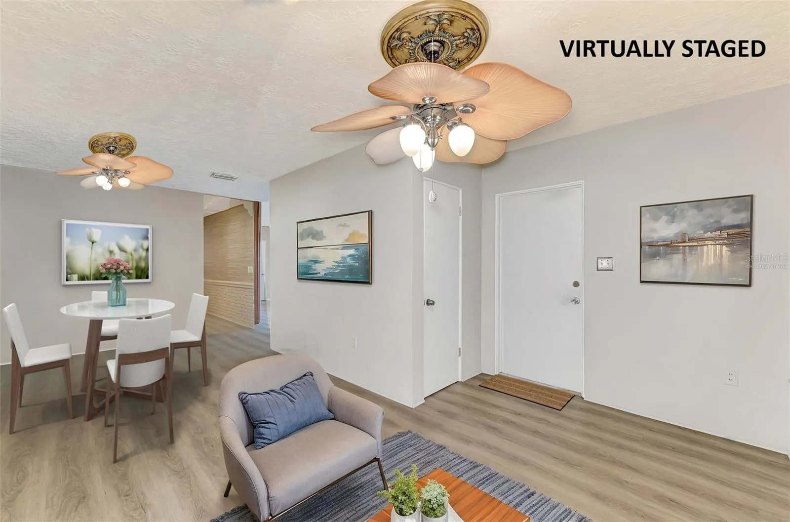 Virtually staged dining area and part of family room