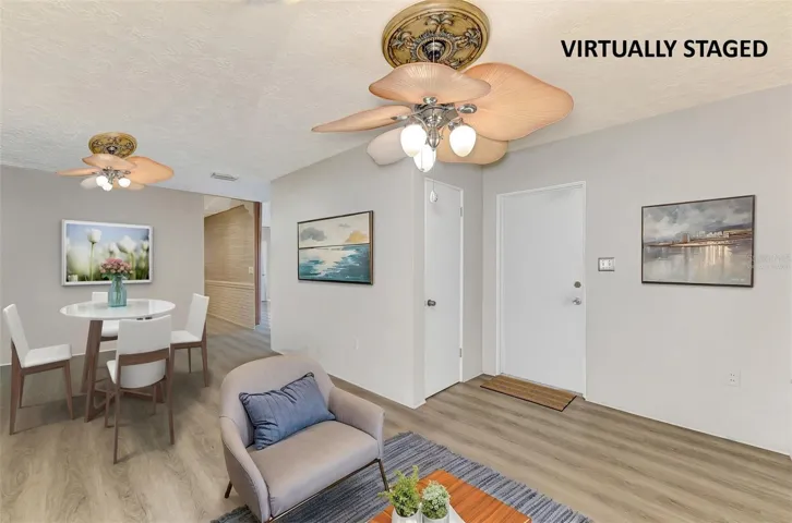Virtually staged dining area and part of family room