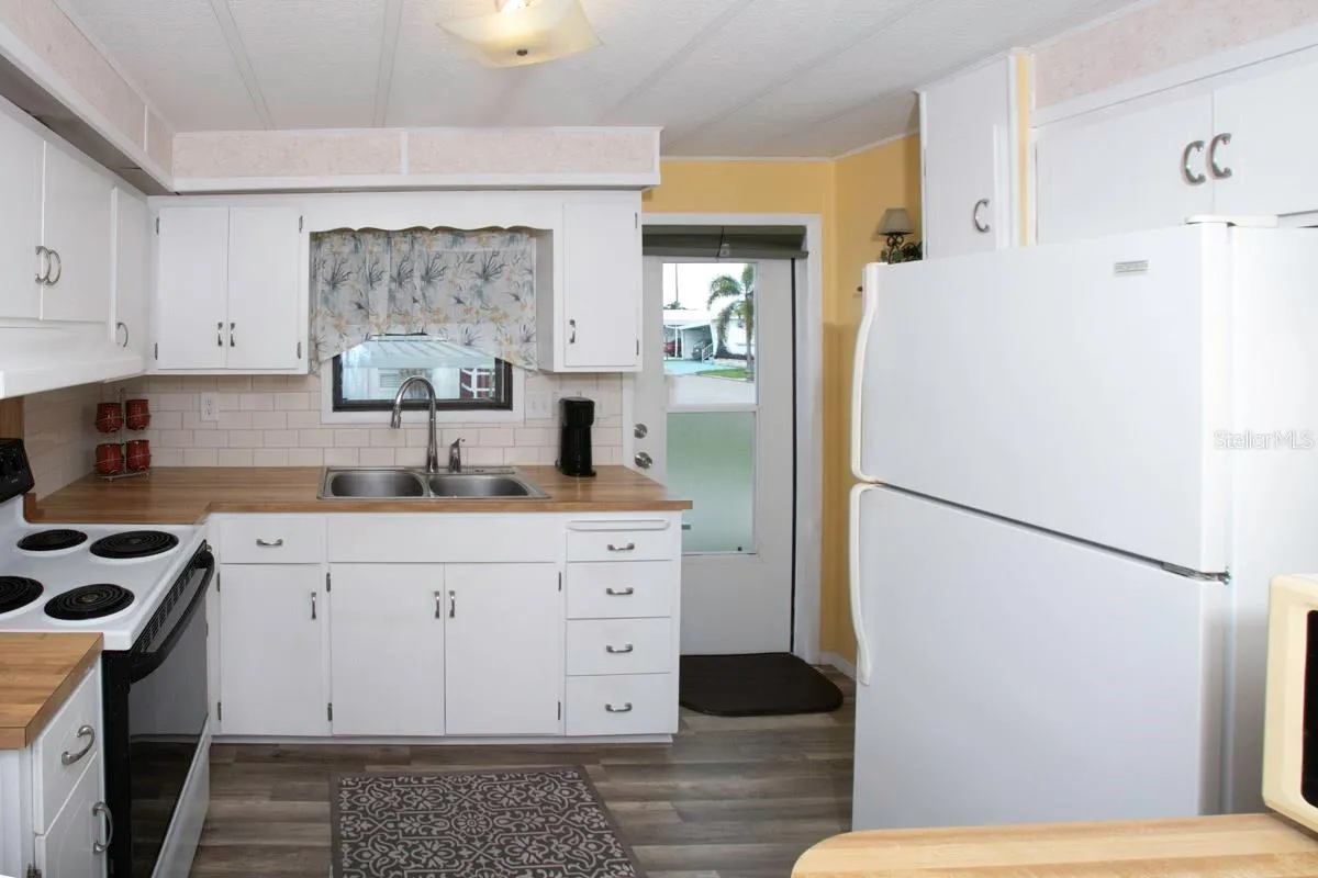Kitchen with door to outdoors