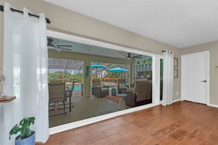 IMPACT POCKET DOORS OPEN TO SCREENED LANAI