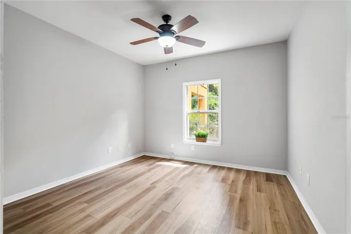 Bedroom with View of Backyard Greenspace