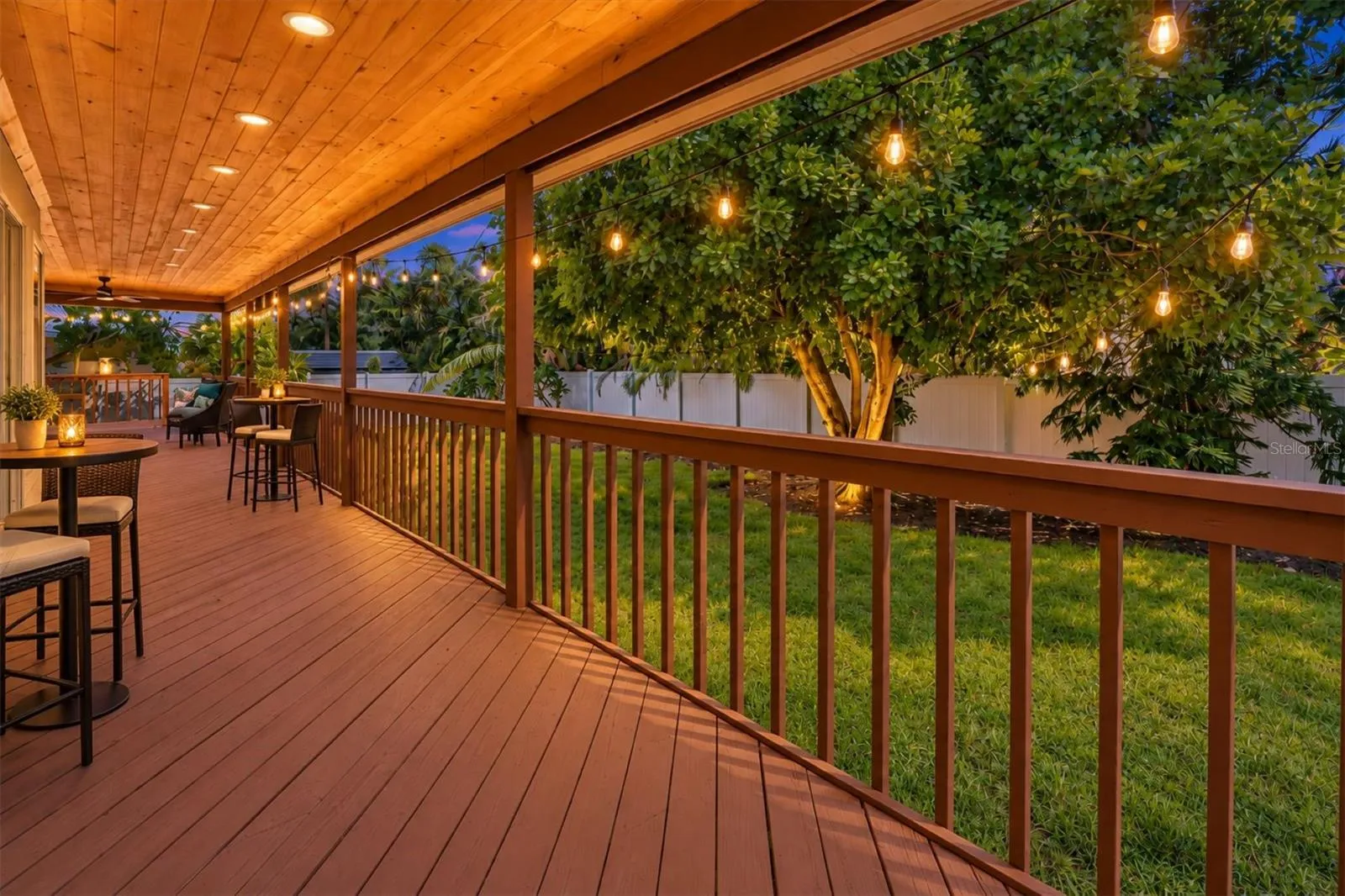 Private primary suite enjoys tropical views and direct access to the covered lanai.