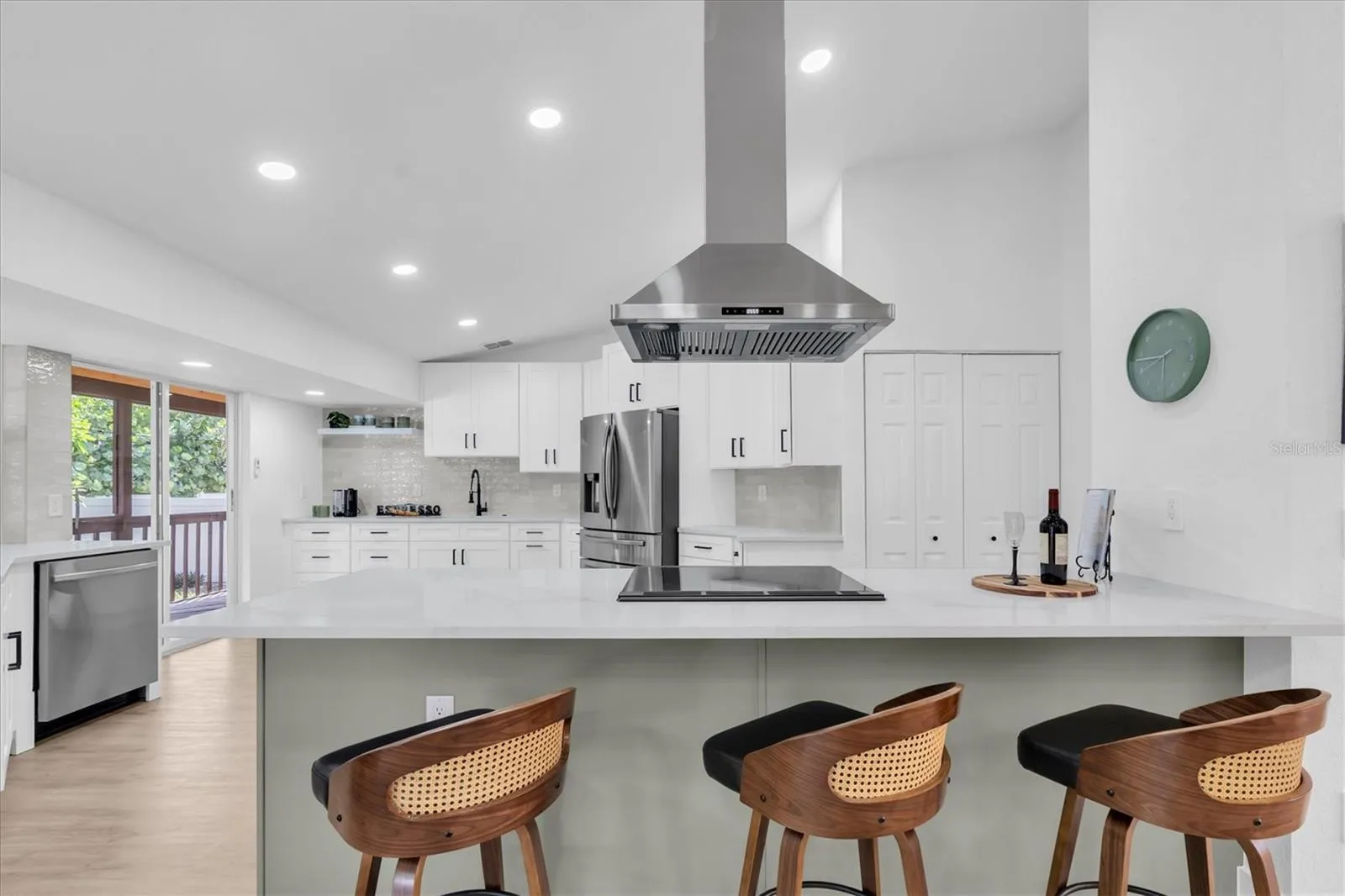 Oversized statement island offers exceptional space for gathering, dining and entertaining.