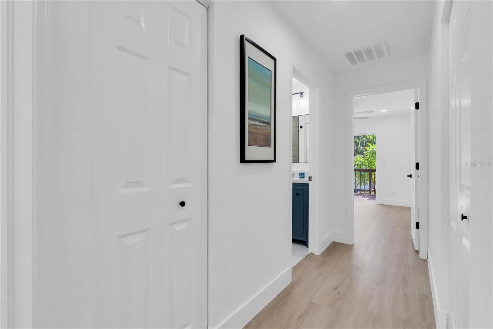 Split-bedroom design places two additional bedrooms on the opposite side of the home.