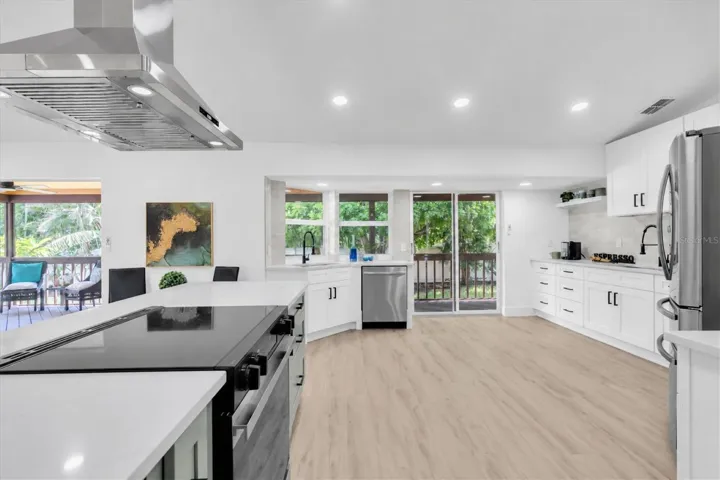 Stunning NEW kitchen with quartz surfaces, custom cabinetry and stainless steel appliances.