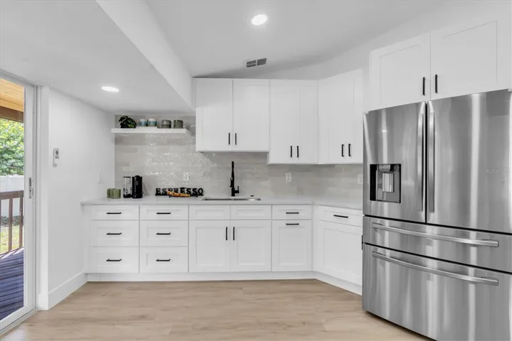 Two generous sinks—including a dedicated prep sink—plus two pantries provide outstanding functionality.