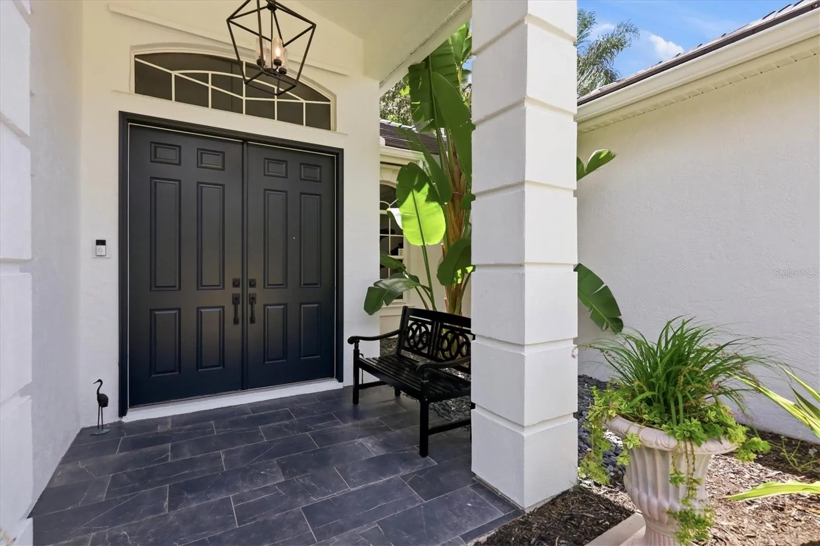 8 foot doors throughout lend grand scale to this gorgeous courtyard home