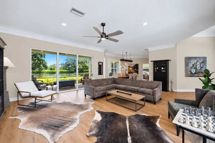 Gorgeous lake views from the Great Room- These doors pocket completely into the walls, expanding your living space!