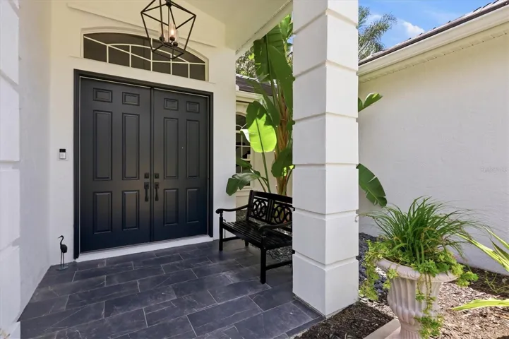 8 foot doors throughout lend grand scale to this gorgeous courtyard home