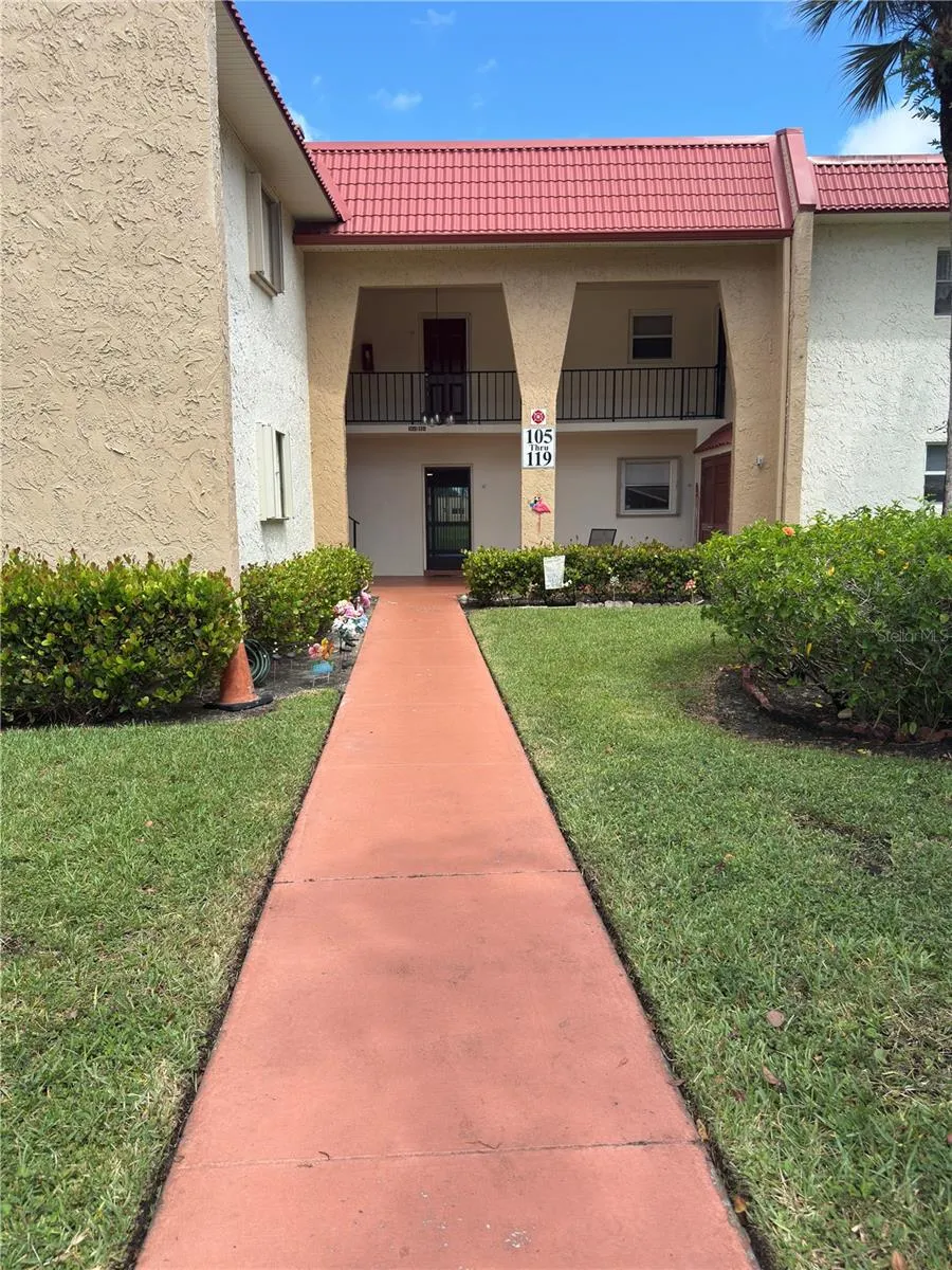 First floor center unit. Assigned parking space just in front of the walkway to front door.