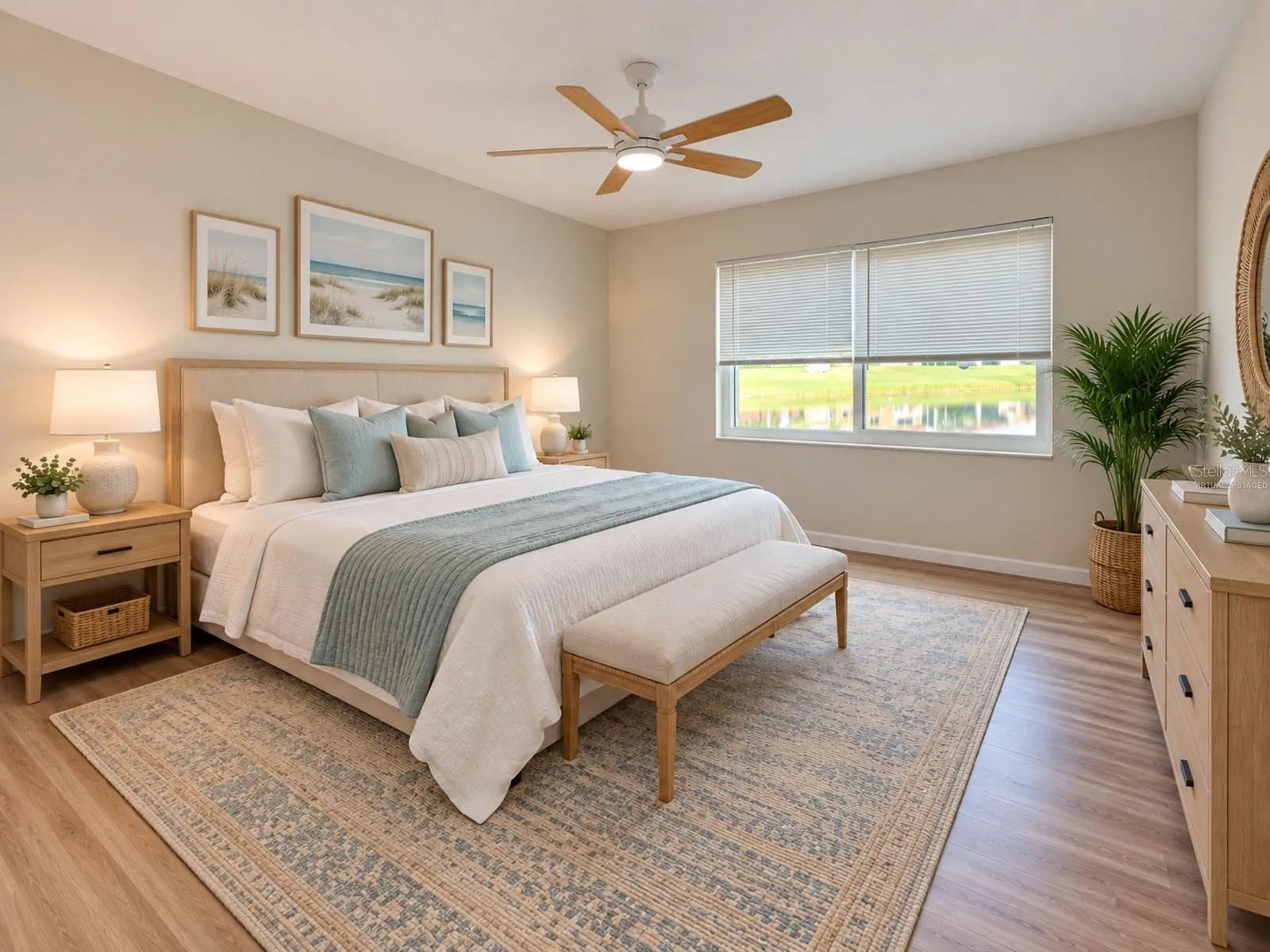 Primary bedroom with water view. Virtually staged