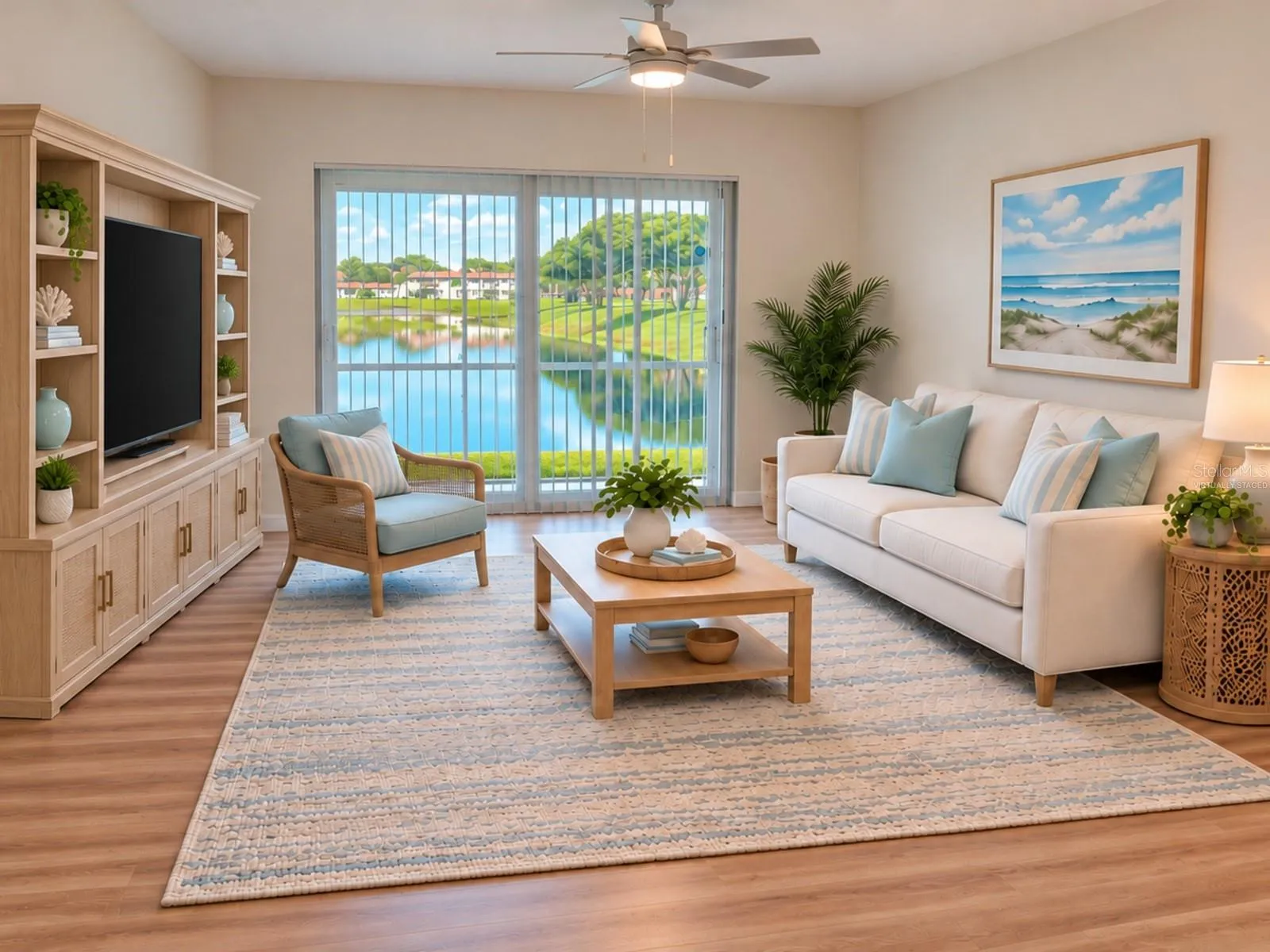 Living room with screened patio and water view. Virtually staged