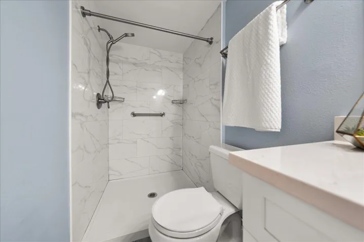 Primary bath totally updated with newer shower, vanity, toilet, flooring, etc.