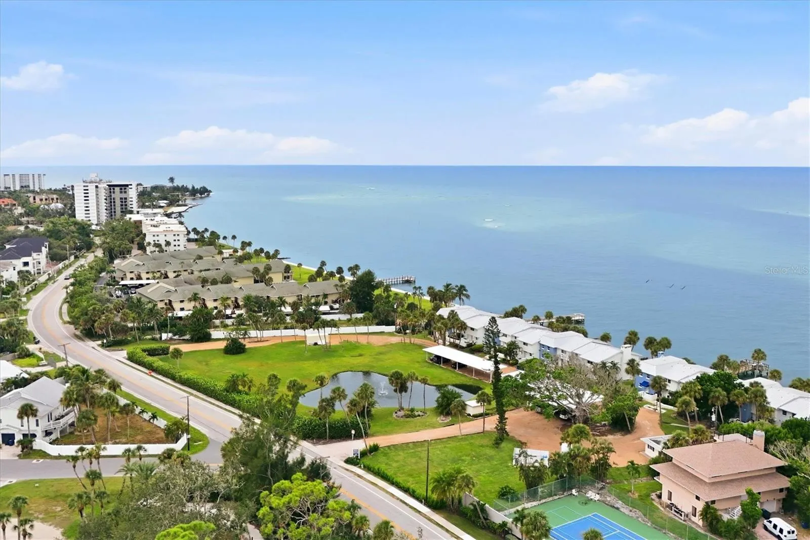 Siesta Town House Community -- the U-shaped pebble driveway w/grassy area and fountain!