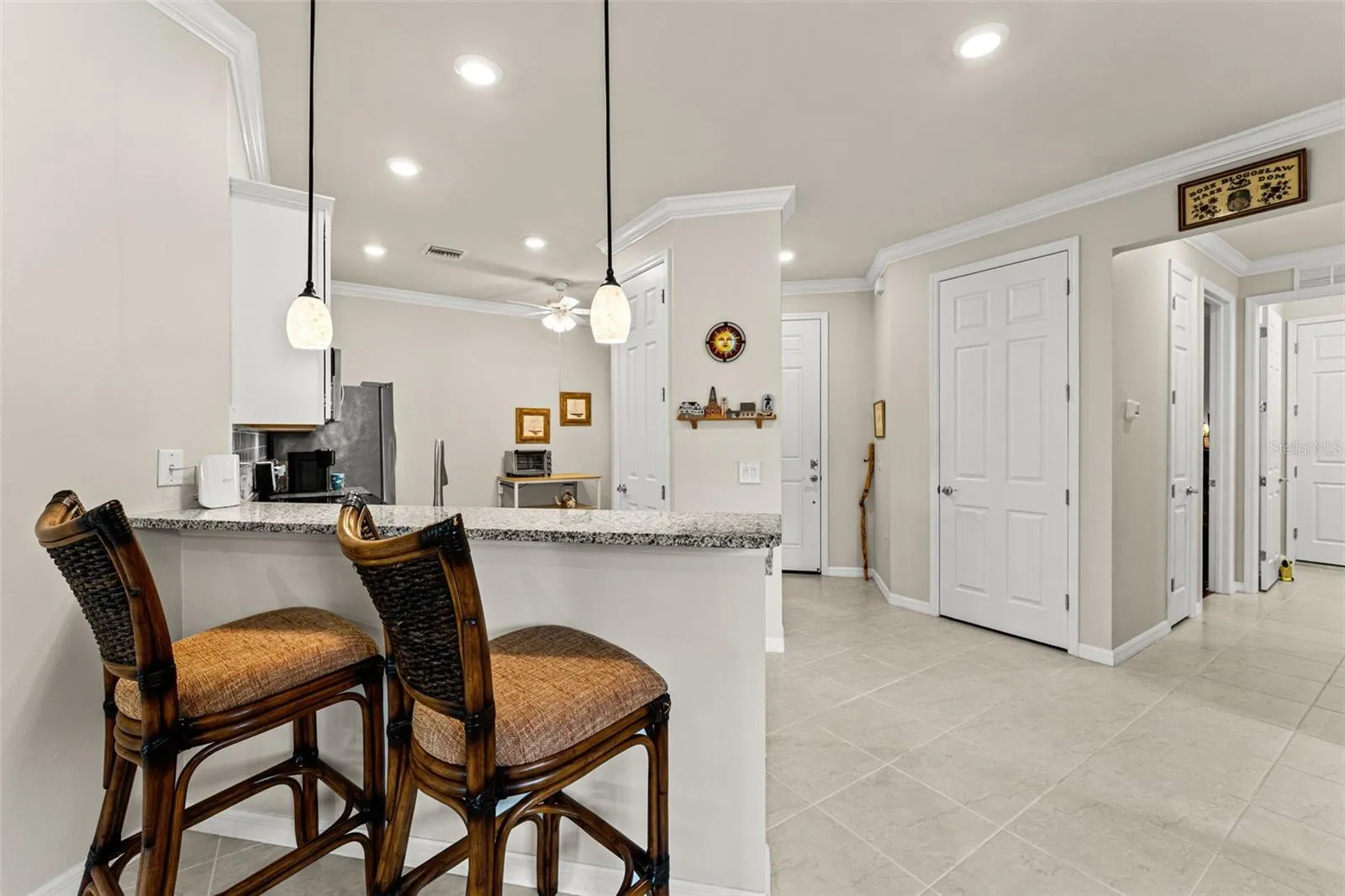 To the right is hallway to guest bed and bath, laundry and garage