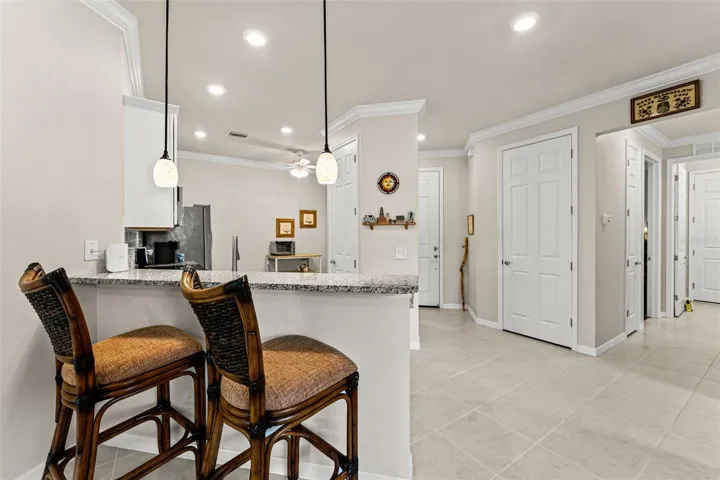 To the right is hallway to guest bed and bath, laundry and garage