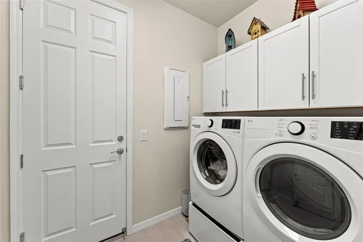 Laundry room with door to garage