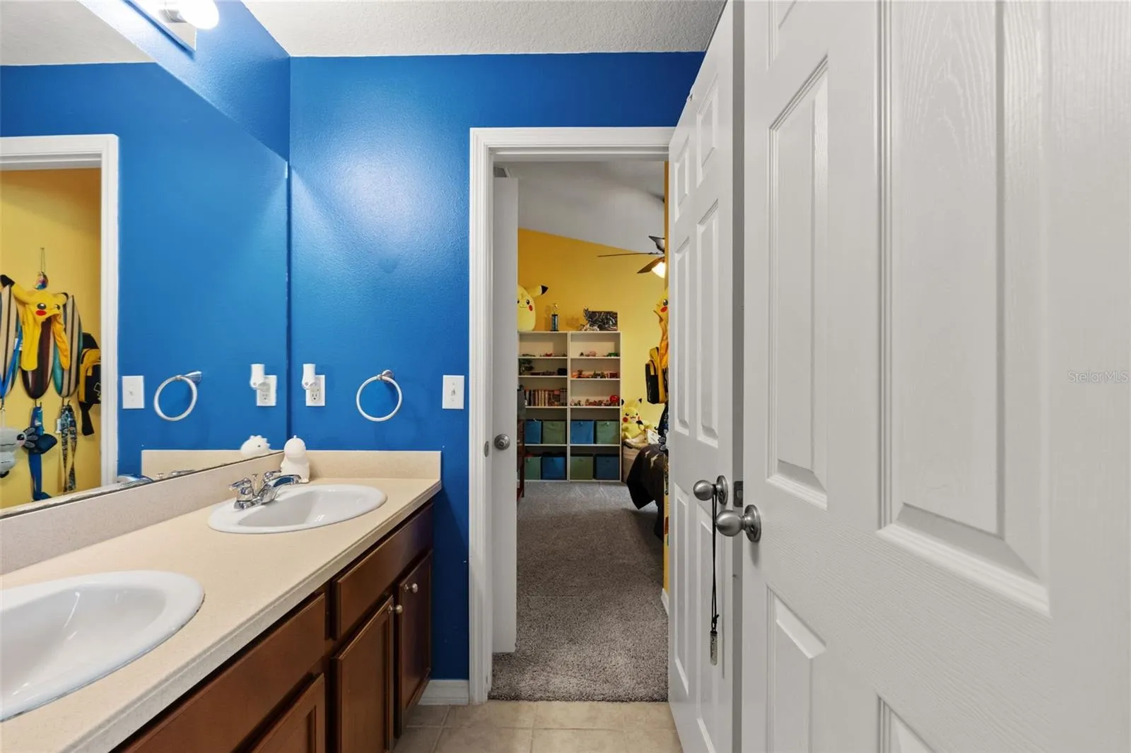 A full secondary bath with a spacious vanity provides convenient everyday functionality.