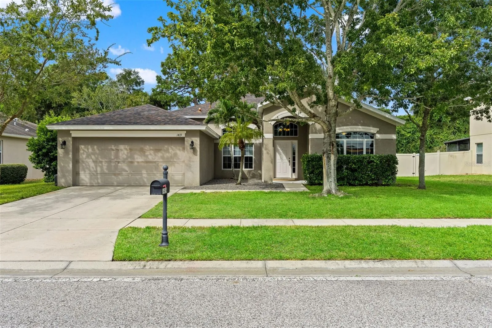 Attractive single-story curb appeal, mature landscaping, and a two-car garage welcome you home.