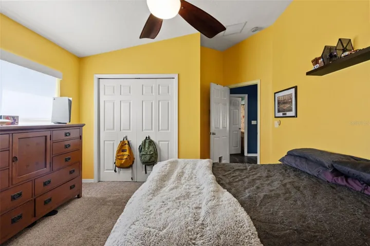 Comfortable proportions, natural light, and a full-size closet make this secondary bedroom both functional and inviting.