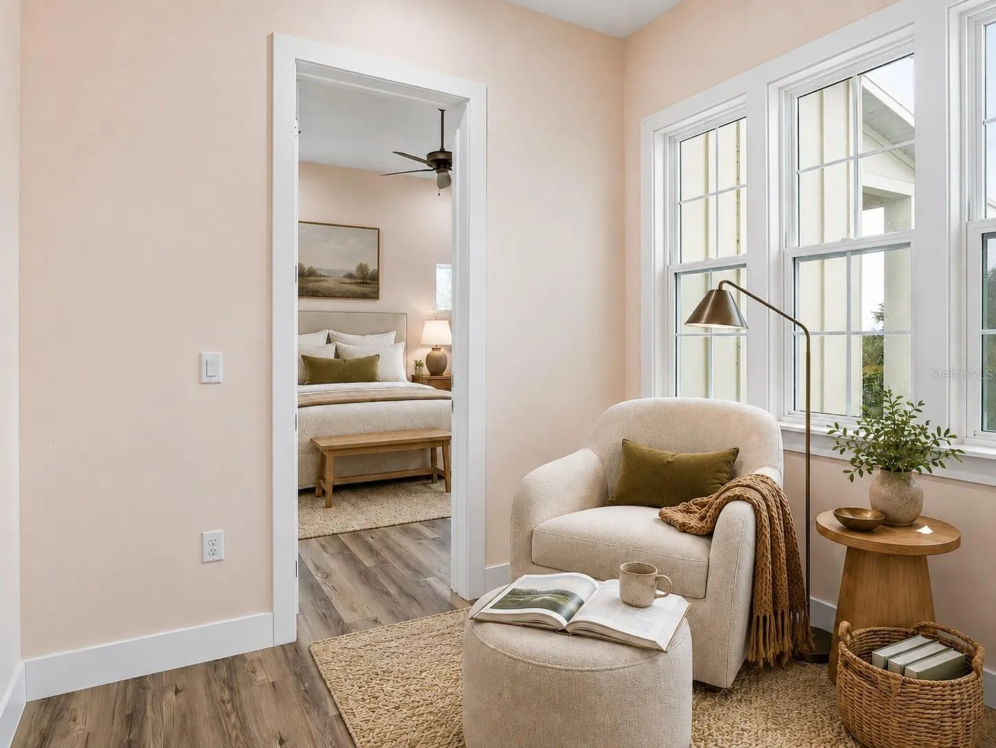 Virtually added furniture into sitting room outside primary bedroom