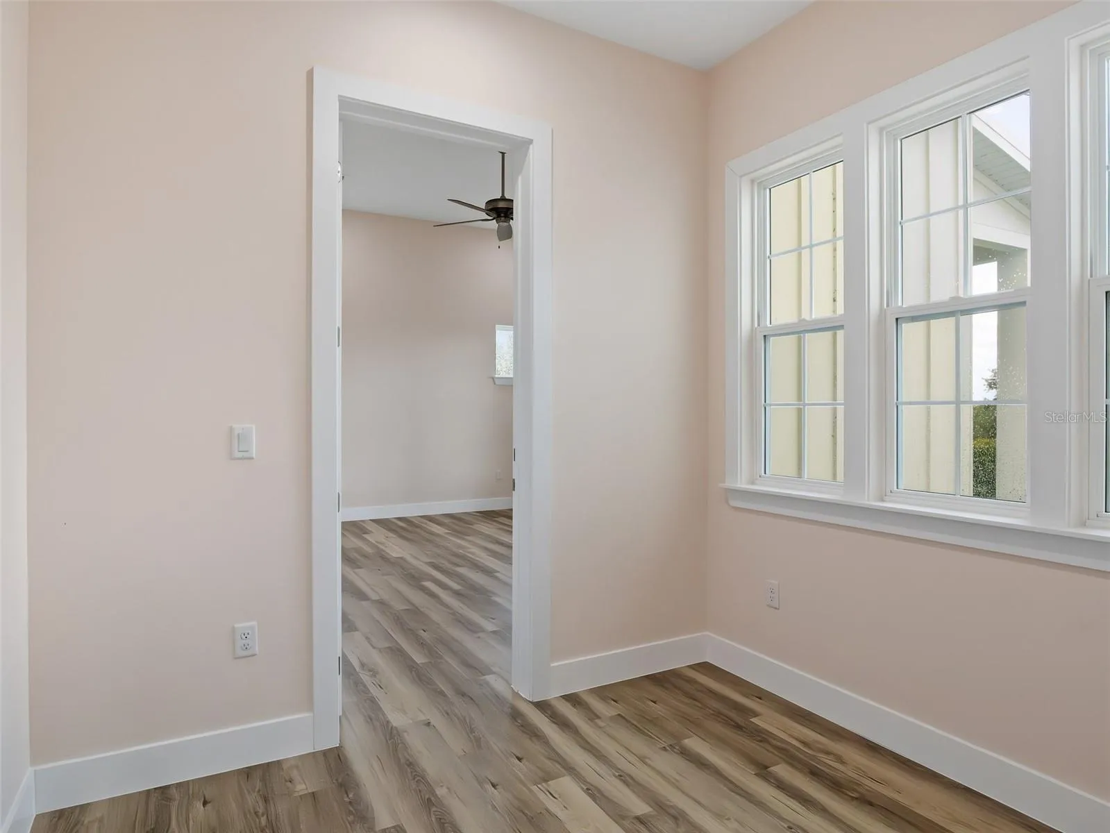 Sitting room looking into primary bedroom