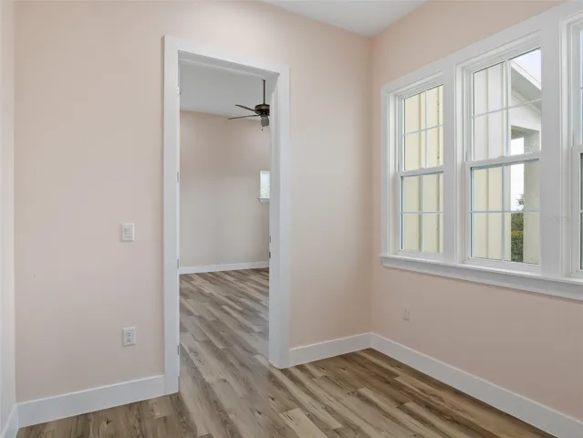 Sitting room looking into primary bedroom