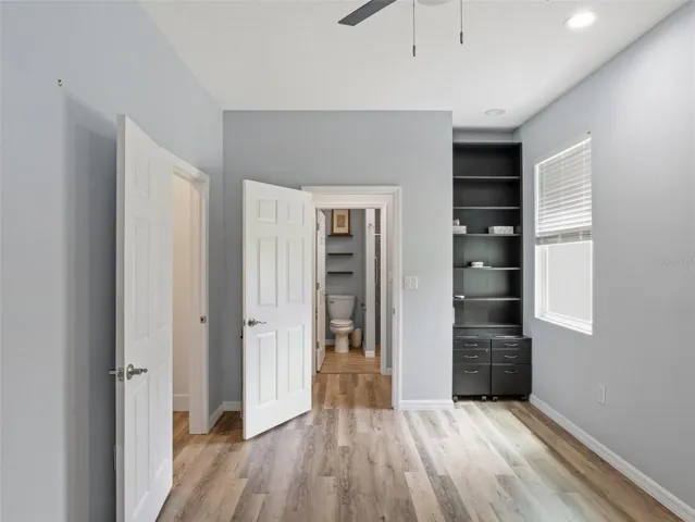 Guest house bedroom/office, closet to left