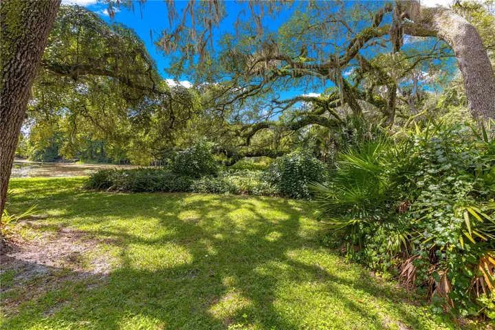 Mature trees and lawn across the grounds.