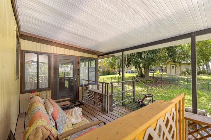 Covered porch facing the yard.
