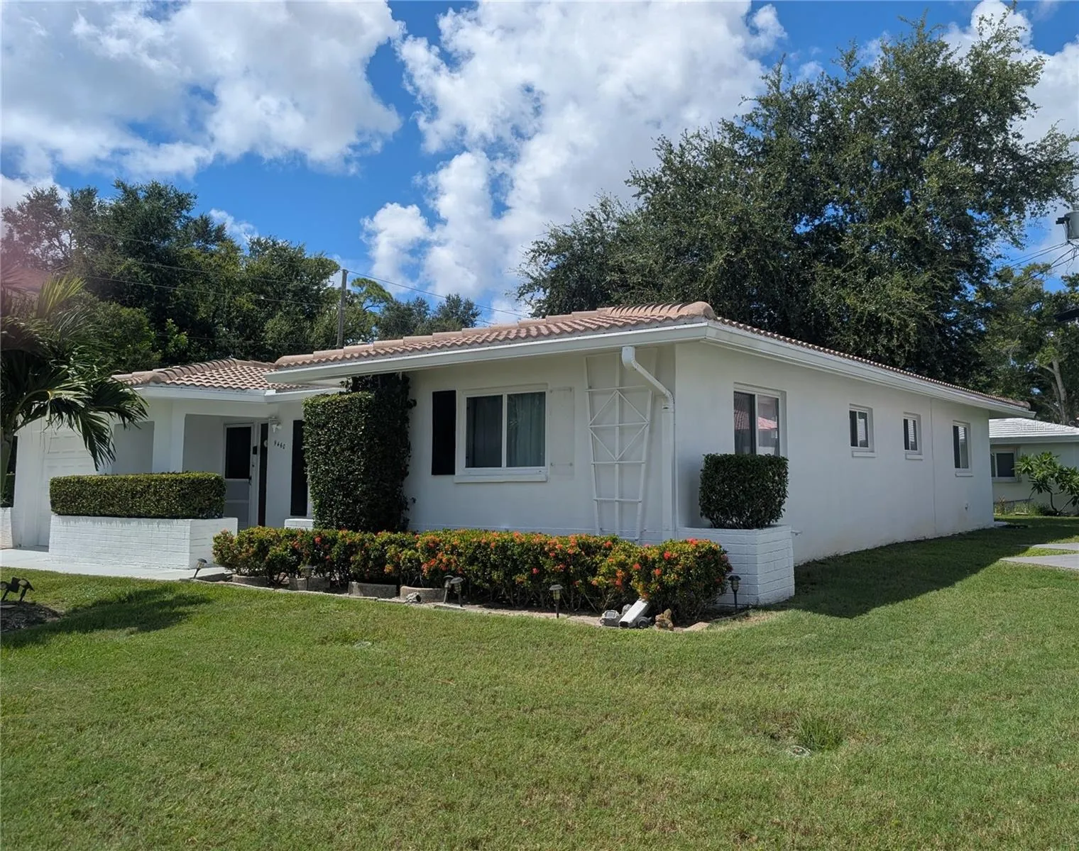 view of side.  Most windows have been replaced. 7 impact windows installed 2019.