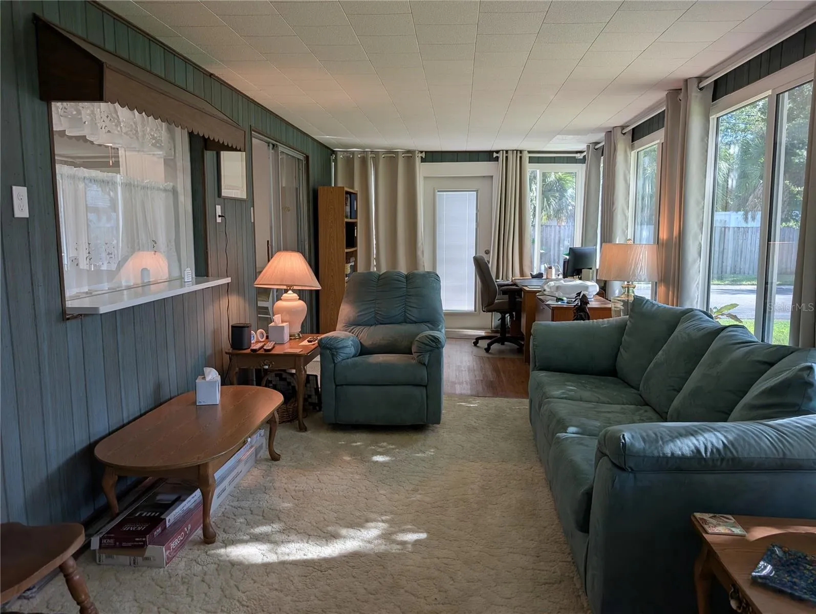Florida room has wall of windows for great natural light/airlow.