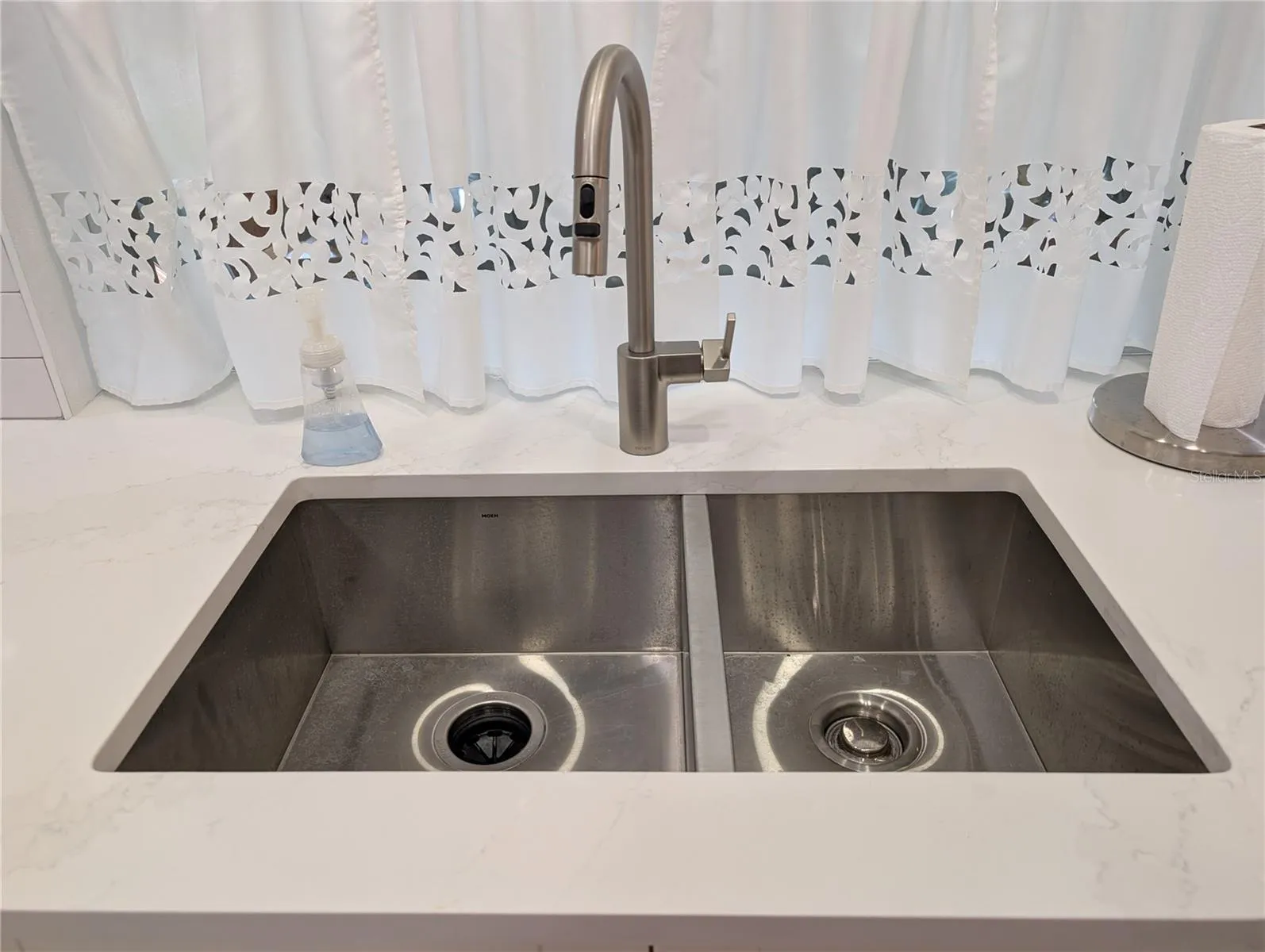 Double sided, undermount, stainless steel sink &amp; tall kitchen faucet w/pulldown sprayer.