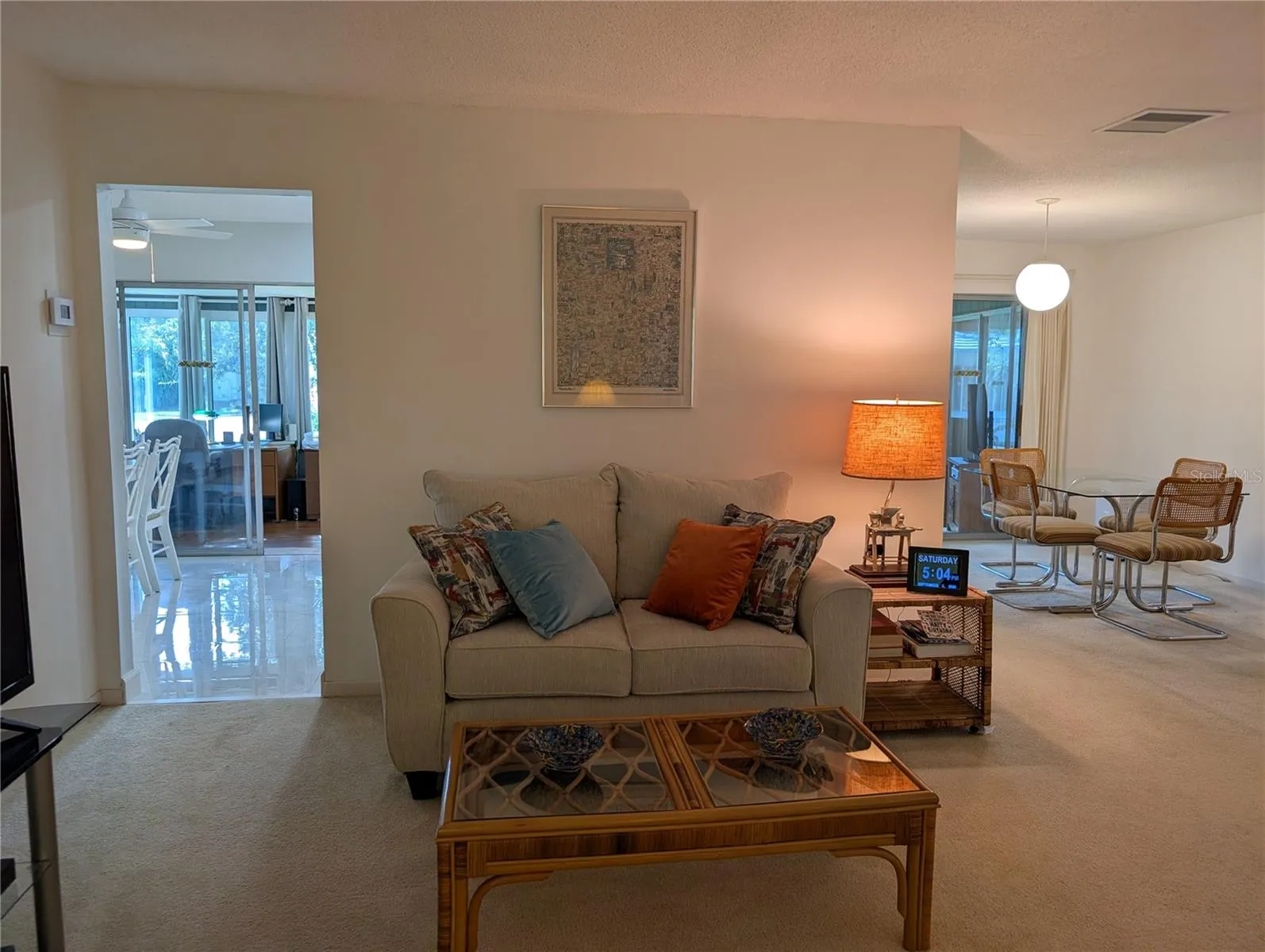 View from living room thru kitchen to Florida room (left) and thru dining room to Florida room (right).