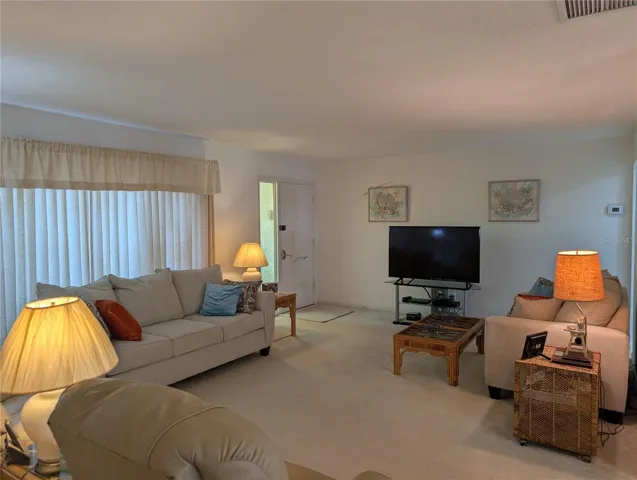 View of front entry into living room.