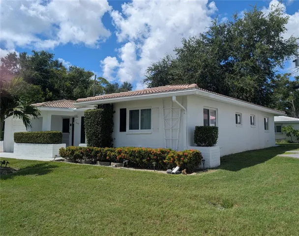 view of side.  Most windows have been replaced. 7 impact windows installed 2019.