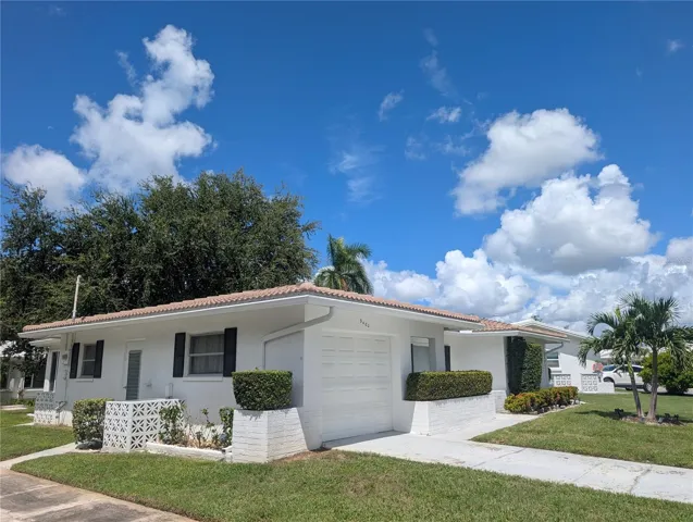 Exterior features include new tile roof (2025) and gutters/downspouting.
