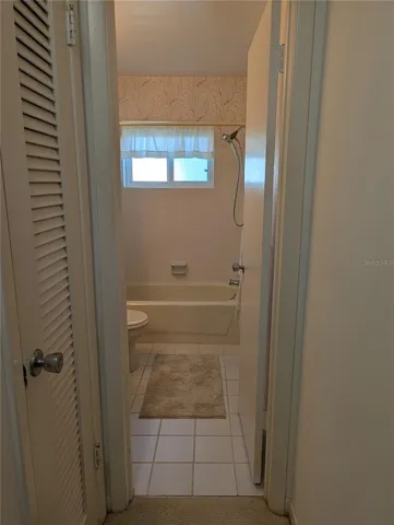 Linen closet at main bathroom entry.