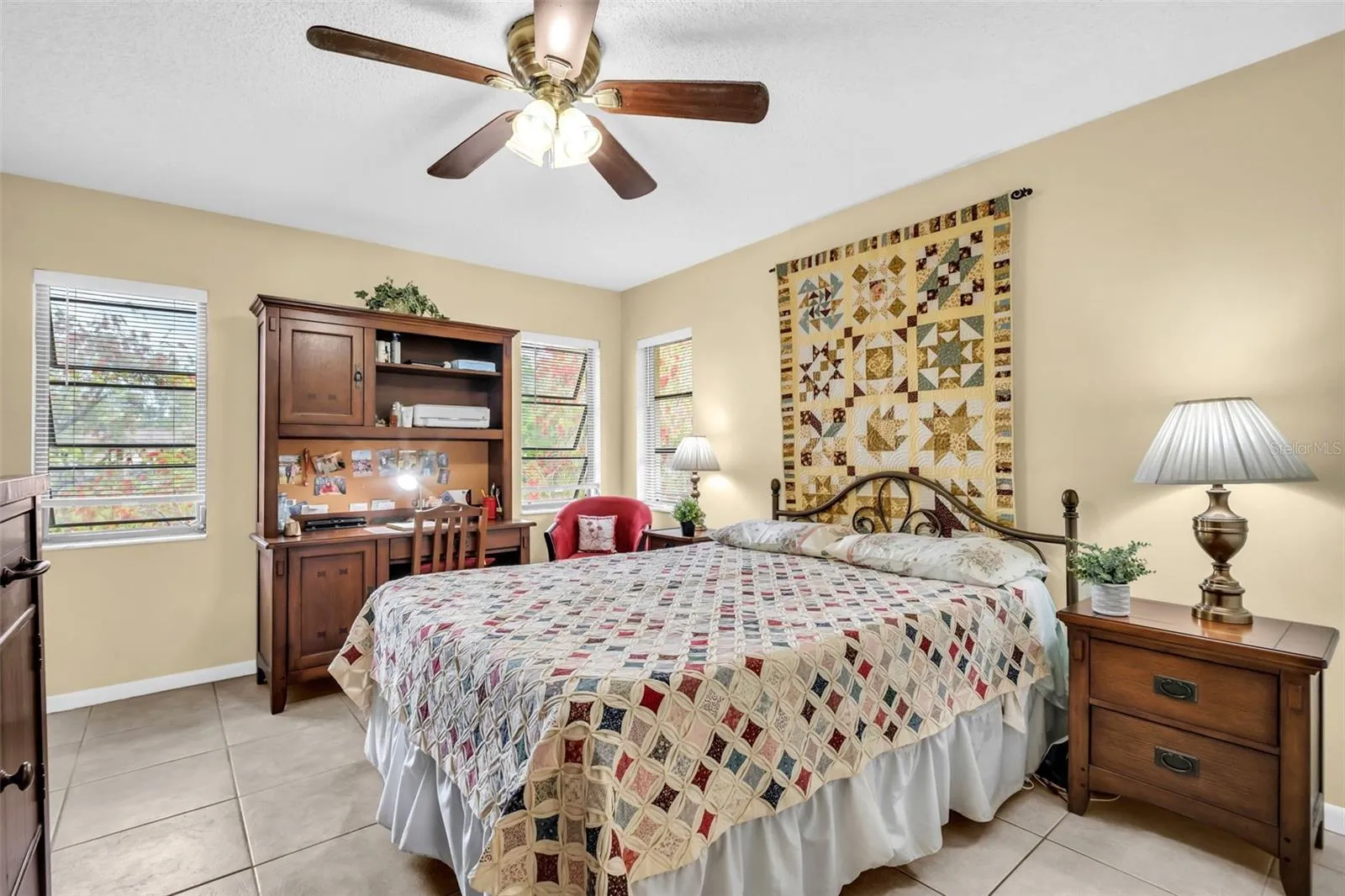Oversized primary suite with serene pond & pool views~