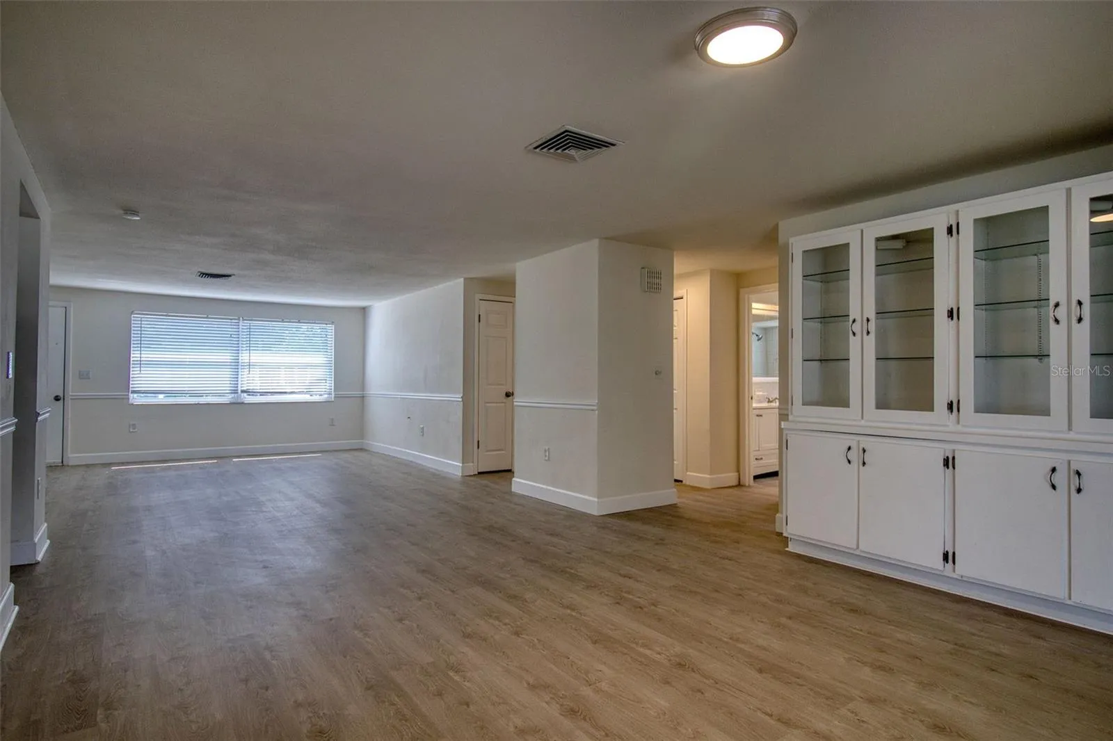 Den with cabinets